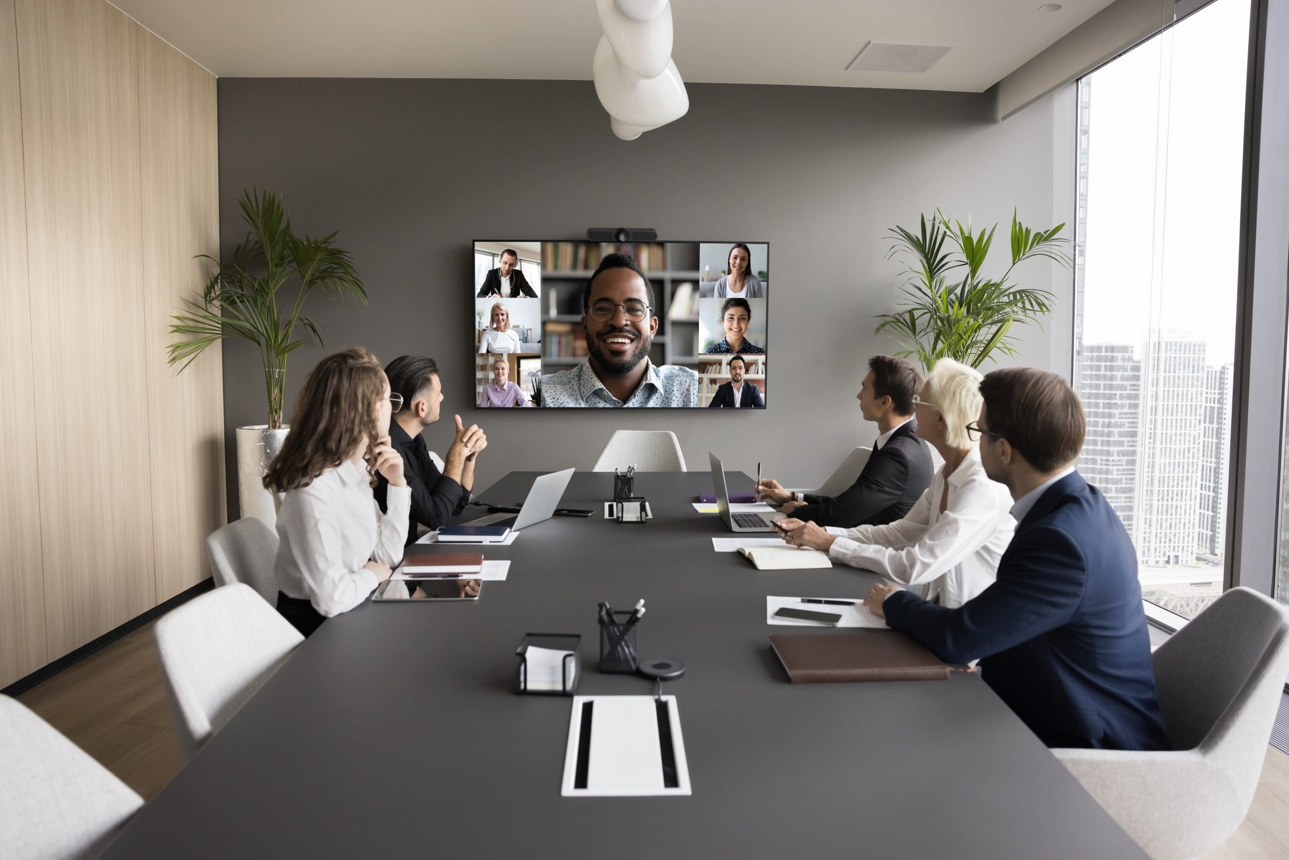 Young African American business leader holding video conference